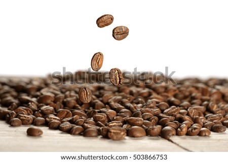 Closeup of fresh coffee beans falling. macro