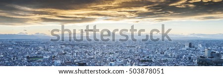 Mt.Fuji covered with snow and Japan cityscape on the sky in twilight