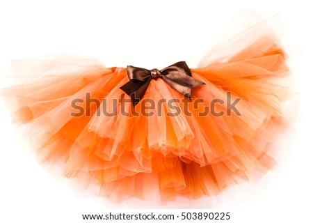 Orange skirt tutu with brown bow on a white background Royalty-Free Stock Photo #503890225