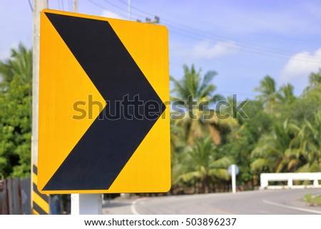 Traffic sign alerts turn right curve of the road