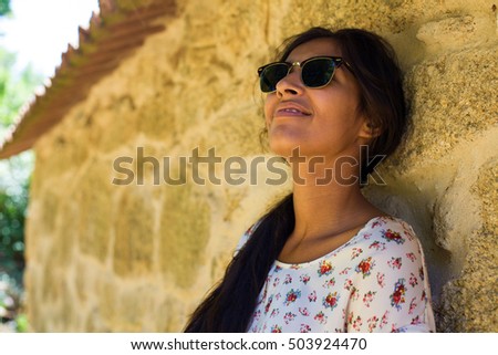 young woman against the wall