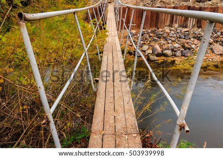Temporary metal bridge over the river