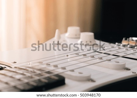 closeup picture of electric rock guitar , film and grunge style