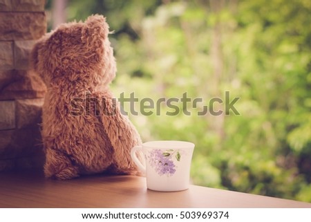 teddy bear relax time, teddy bear alone with a cup of coffee.