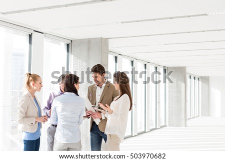 Business people having discussion in new office
