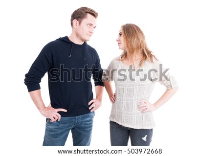 Couple looking at each other with arms on hips like being dominative  isolated on white background with copy text space