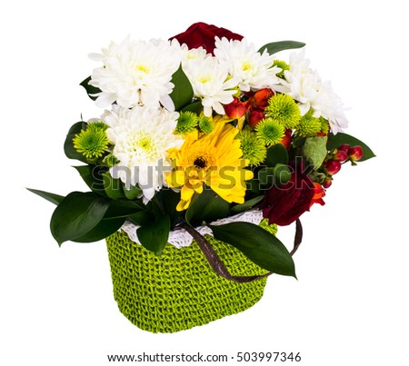 Festive bouquet of flowers in a wicker basket on a white background