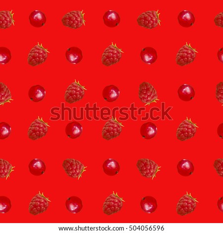 Seamless pattern with isolated berry: raspberry and red currant on red background