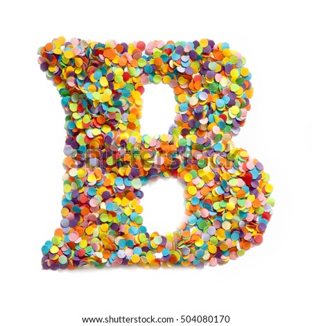 The letter B is laid out colored confetti. White background.