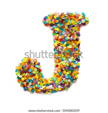 The letter G is laid out colored confetti. White background.