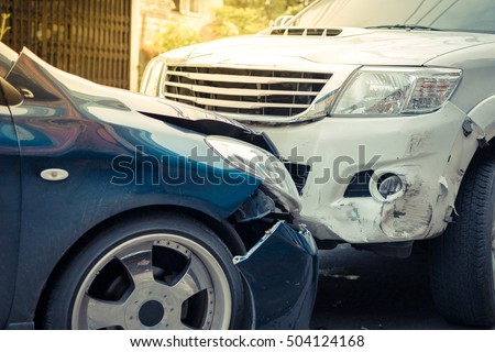 Car crash from car accident on the road in a city between saloon versus pickup wait insurance. , process in vintage style
