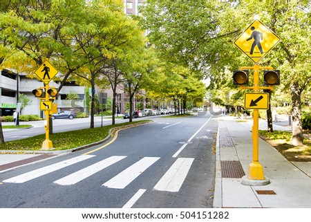 pedestrian crossing in the city. traffic sign and traffic lights on zebra crossing