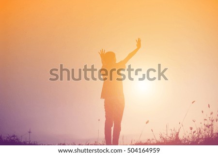 Young woman raise hands up for her success, Concept of Success in life.