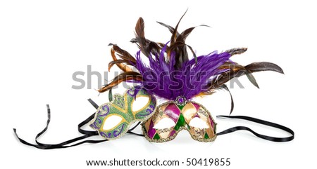 Purple, green and gold mardi gras masks on a white background
