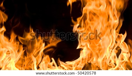 Flames of Fire in a Fireplace against a black Background