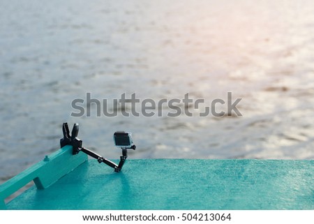 Taking Video, Photo , Time lap by small smart camera setting on the boat