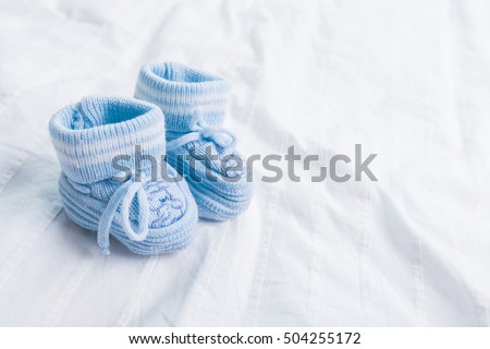 baby booties  for little boy Royalty-Free Stock Photo #504255172