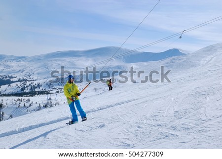 Snowboarder on ski tow