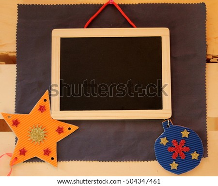 framed blackboard on paper background to compliment the Christmas
