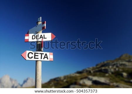 CETA deal written on road sign. At the top of the agenda concept. Mountains in background.