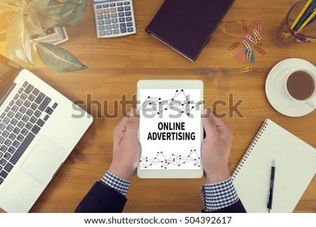 ONLINE ADVERTISING Businessman youch digital tablet, top view
