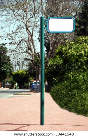 Blank white Street Sign on a green background