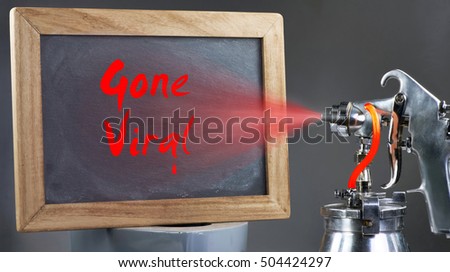 Spray painting a red gone viral sign.