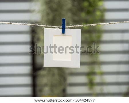 Photo Frames on Rope. background the nature, soft focus
