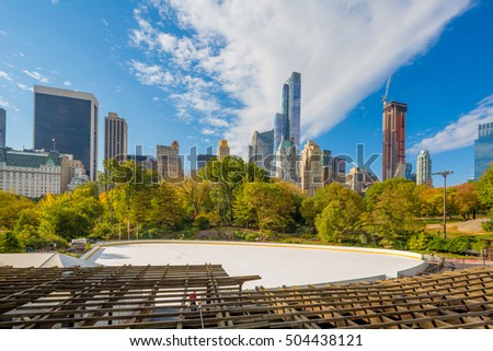 Central Park at Autumn.  Midtown skyline and ice rink in Manhattan. New York City