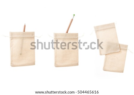 A set(group) of many(variety) shape brown linen pocket with pencil isolated white.