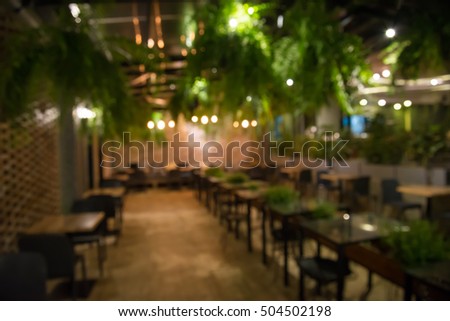 Abstract blur restaurant at night for background usage