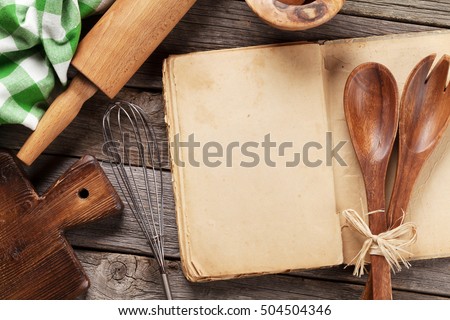 Blank vintage recipe cooking book and utensils. Top view with copy space Royalty-Free Stock Photo #504504346