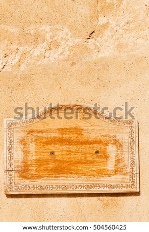 in a concrete wall the wooden vintage empty panel blank and abstract