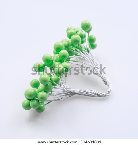 Colorful glossy handmade beads on white background