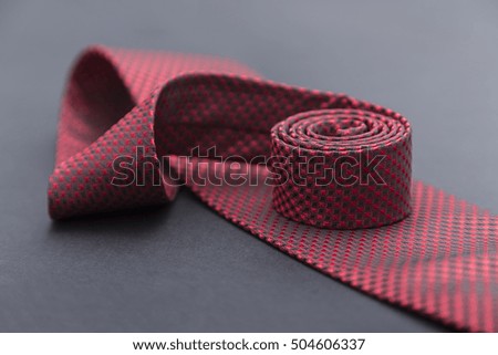 Red tie with black squares