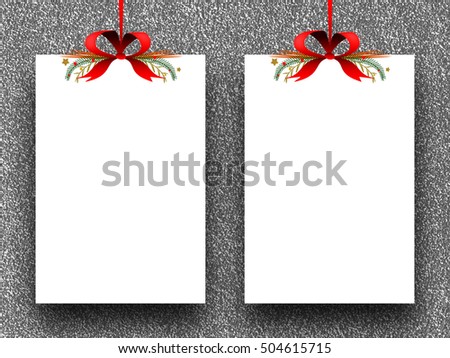 Two blank frames hanged by red ribbons against silver glitter background