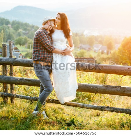 happy loving couple in the mountains . the atmosphere of the sunset. Love concept.