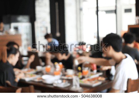 abstract blurred group of asian friends meeting in the restaurant background.