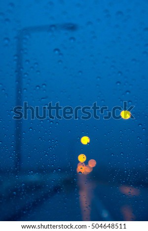 street light through the window during raining