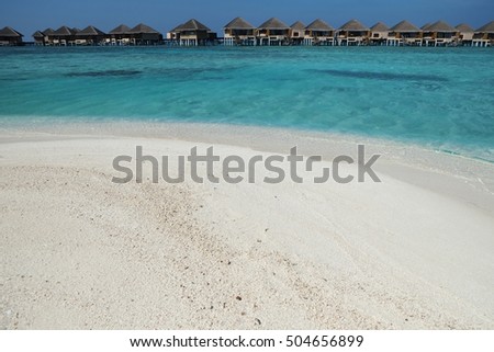 sand beach, surf and warm weather at Maldives