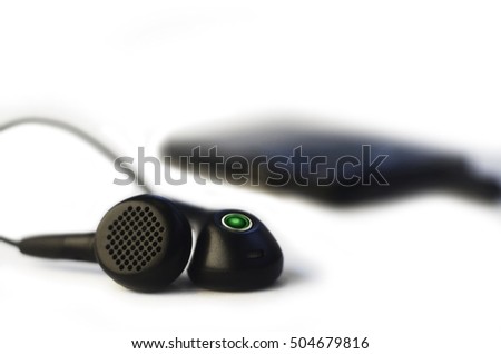 Small headphones isolated on a white background. Music listening concept