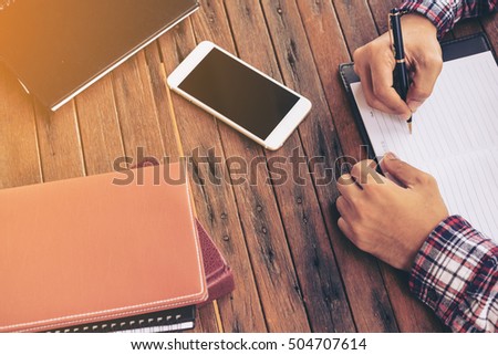 Businessman working on a desk. Freelance work at home office.