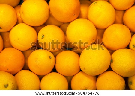 Lots of bright oranges in supermarket.