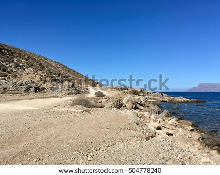 The famous lagoon of Balos is located approximately 56km northwest of Chania and 17km northwest of Kissamos, formed between the Cape Gramvousa and the small Cape Tigani.  Royalty-Free Stock Photo #504778240