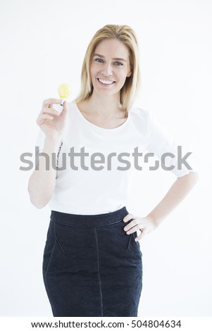 Beautiful blonde business woman with idea bulb in hands isolated on white background