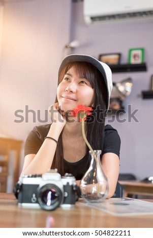 Traveler girl living happily inside a coffee shop.