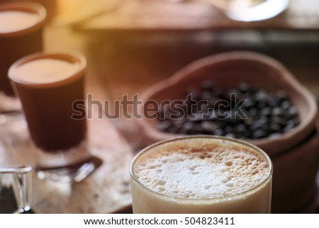 Closeup of a cup of Cappuchino coffee. vintage style effect picture