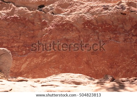 Prehistoric paintings on a cliff in the northeast of the country via Thailand. ; Sand stone texture and ancient painting in Phataem National Park