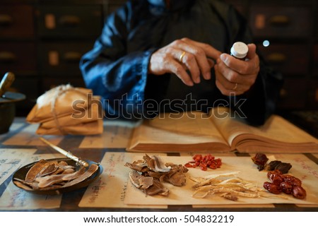 Hands of practitioner making remedy for his patient Royalty-Free Stock Photo #504832219