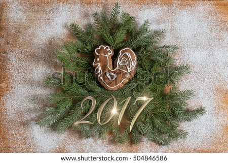 Christmas tree decorated with a rooster and a gold inscription 2017. 